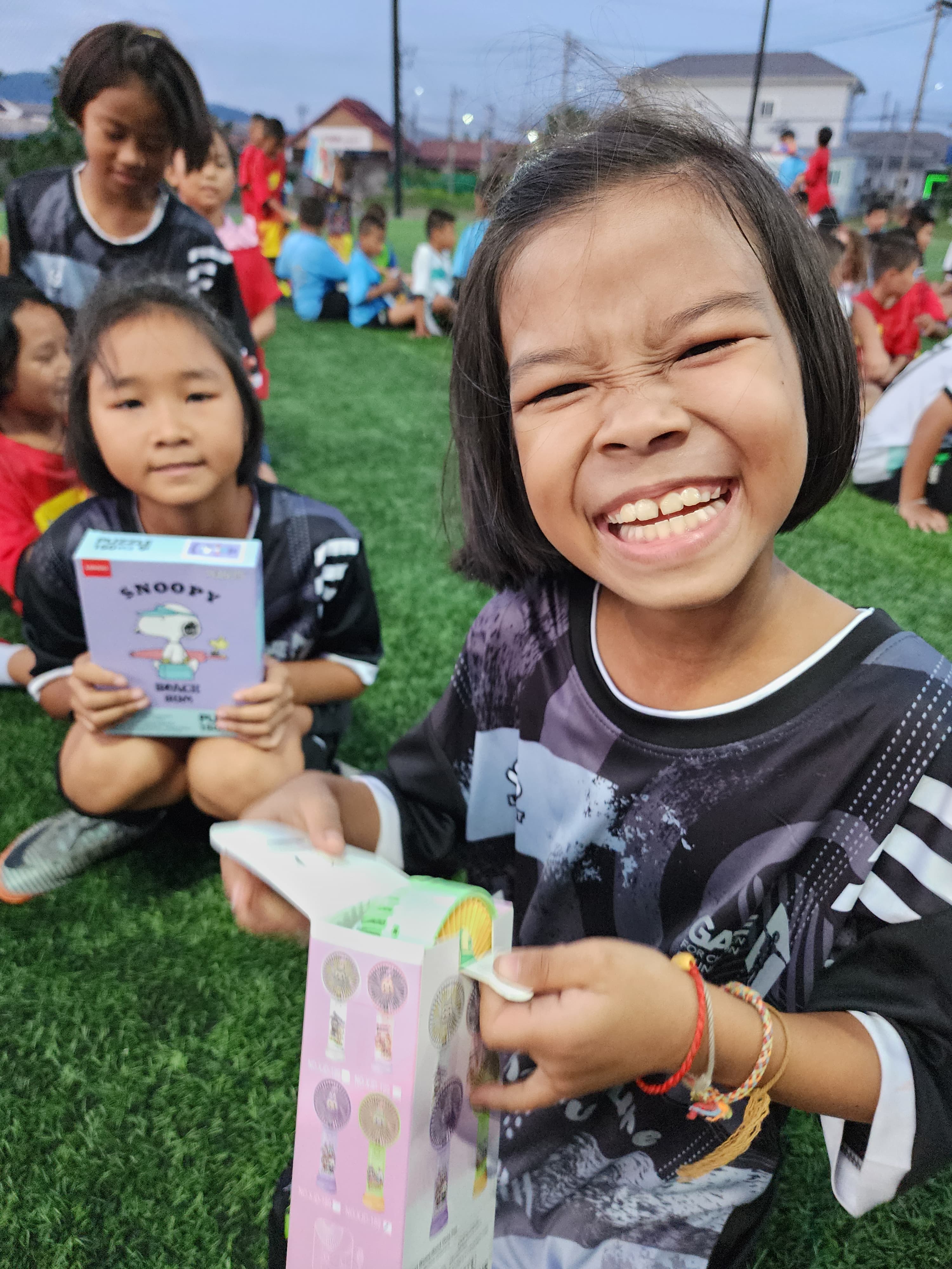 A child smiling brightly at training